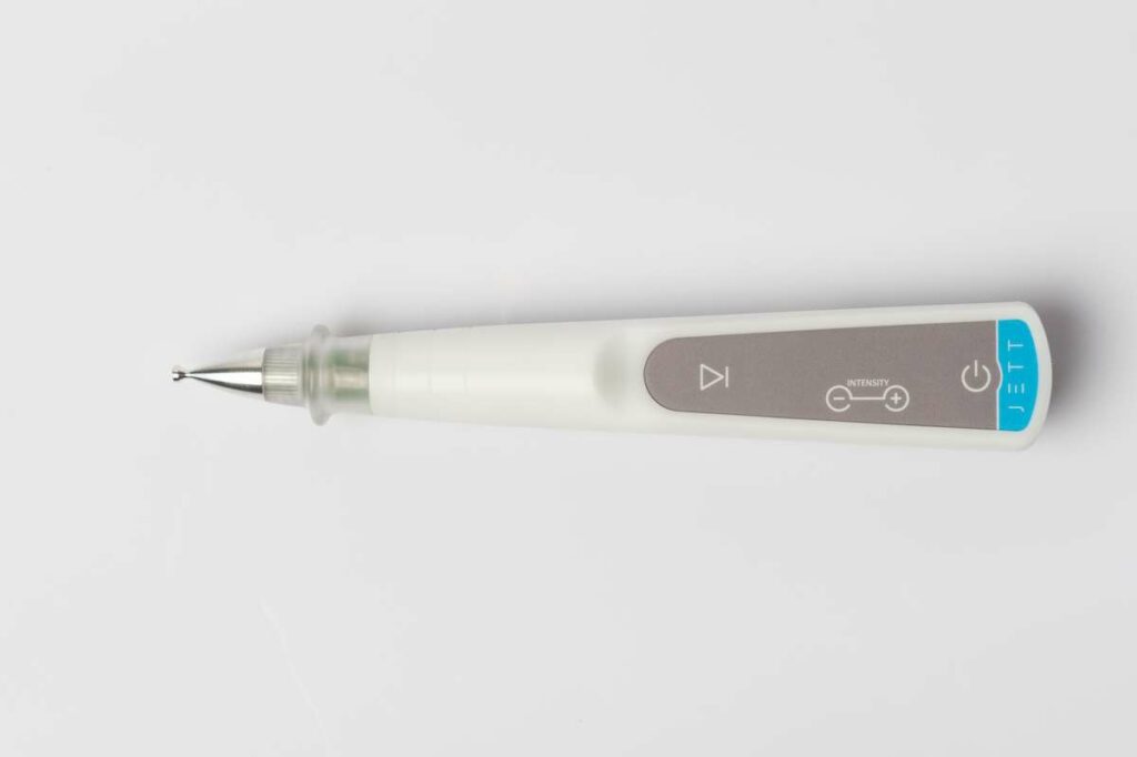 Jett Plasma Pen handheld device with silver tip applicator showing intensity controls for dry eye treatment.